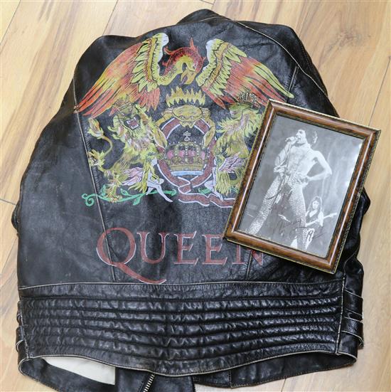 A signed Freddie Mercury photograph dated 1977, signed at Top of the Pops 1977 and a Queen limited edition leather jacket,